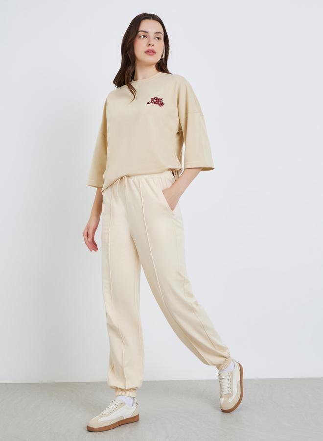 Styli Women Beige Tapered Joggers with Drawstring - Image 4